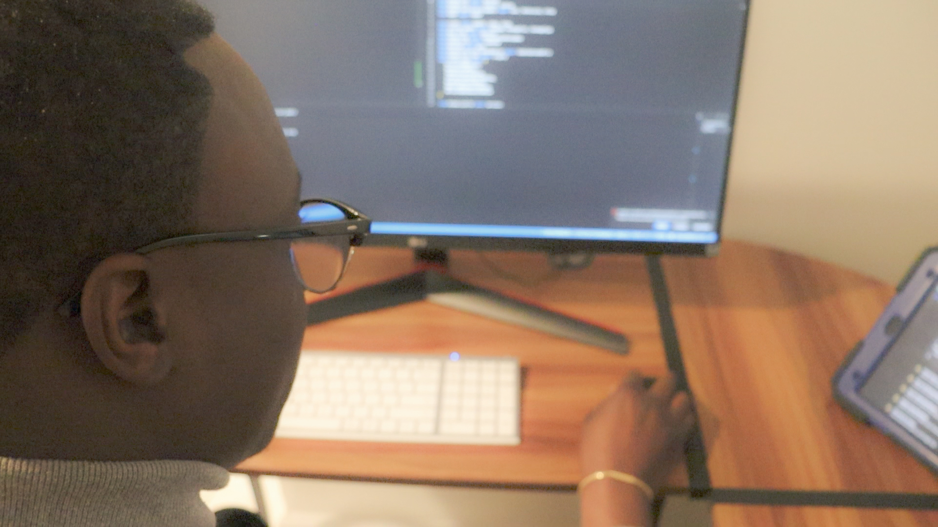 Toyin Ikuomenisan, co-founder of Ikuo Studio, developing custom software/web app